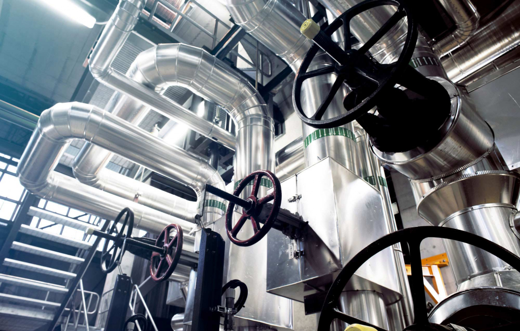 Photo of a manufacturing plant illuminated by hazardous location vaportight LED fixtures